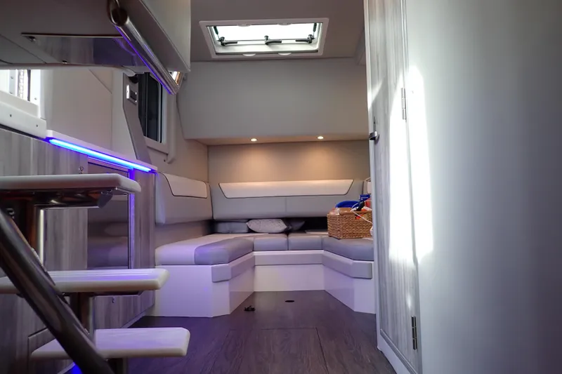 Slide: The Image of Interior of 2024 Formula 400 Super Sport Crossover, featuring modern seating and ambient lighting. - 34