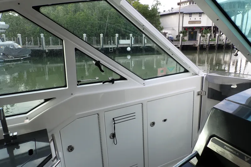 Slide: The Image of 2024 Formula 400 Super Sport Crossover interior with dockside view through windows. - 5