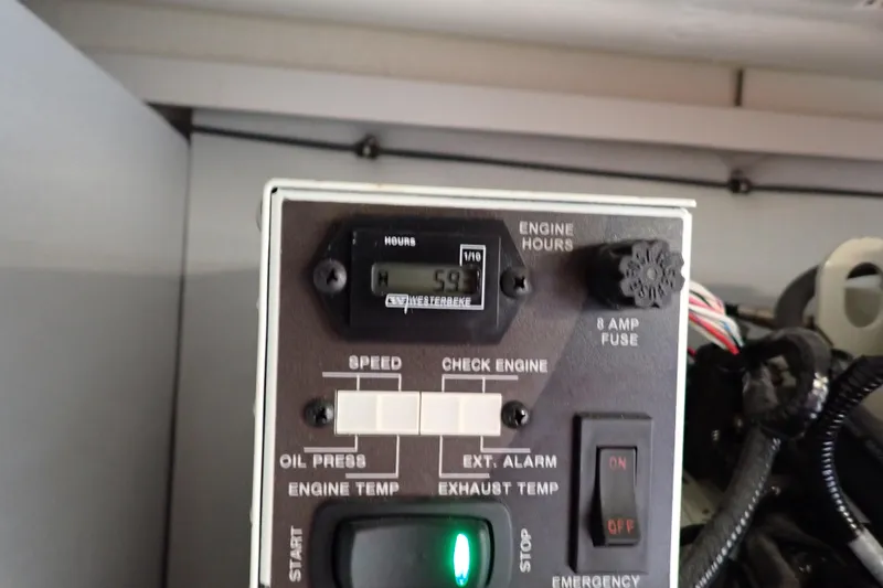 Slide: The Image of Control panel of 2024 Formula 400 Super Sport Crossover showing engine hours and switches. - 8