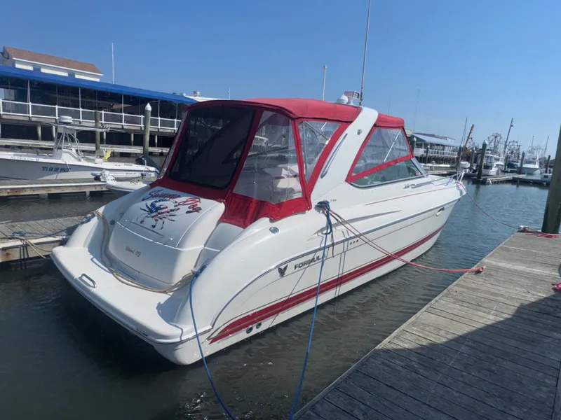 Slide: The Image of 2001 Formula 37 Super Sport boat docked with red canopy. - 1