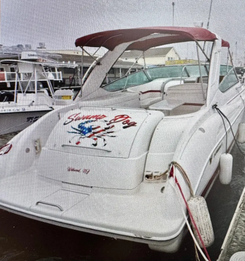 Slide: The Image of 2001 Formula 37 Super Sport boat docked at harbor. - 23