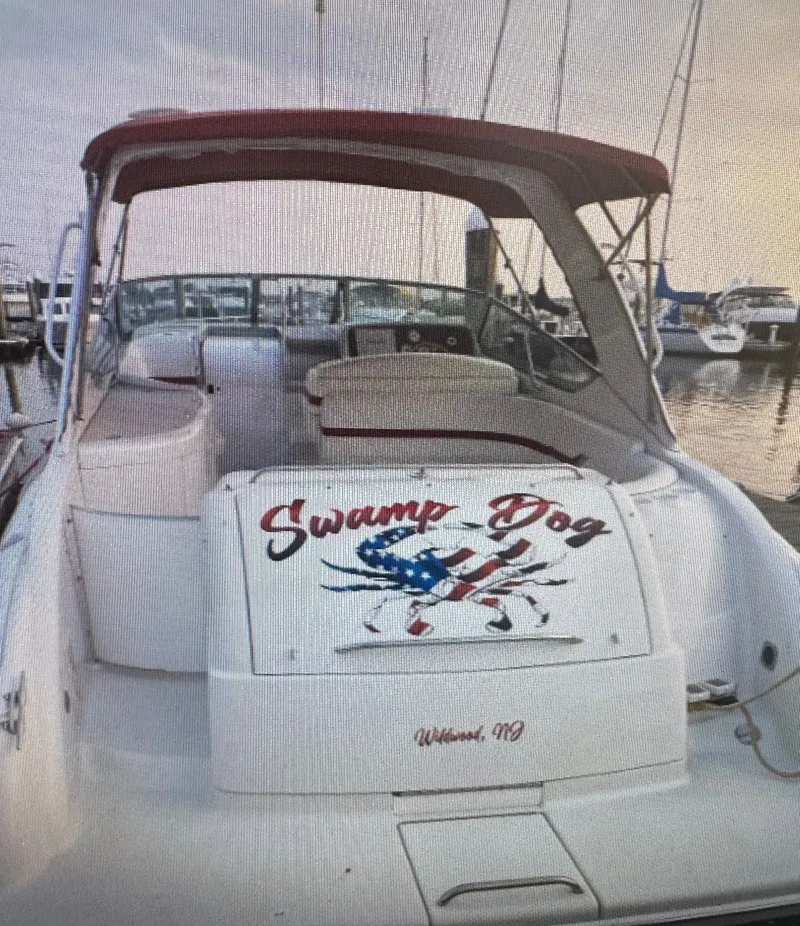 Slide: The Image of 2001 Formula 37 Super Sport boat with "Swamp Dog" lettering at the dock. - 24