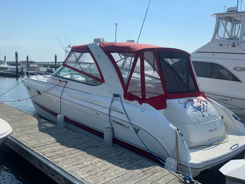 Slide: The Image of 2001 Formula 37 Super Sport boat docked at marina. - 3
