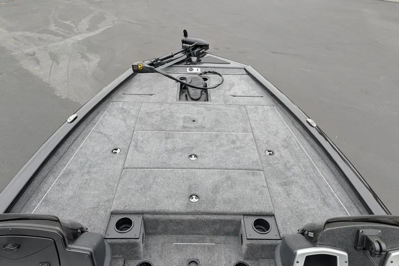 Slide: The Image of 2026 Tracker Pro Team 195 TXW boat deck with gray carpeting and storage compartments. - 10