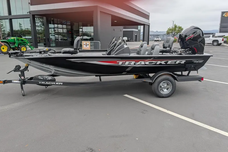 Slide: The Image of 2026 Tracker Pro Team 195 TXW boat on trailer in parking lot. - 5