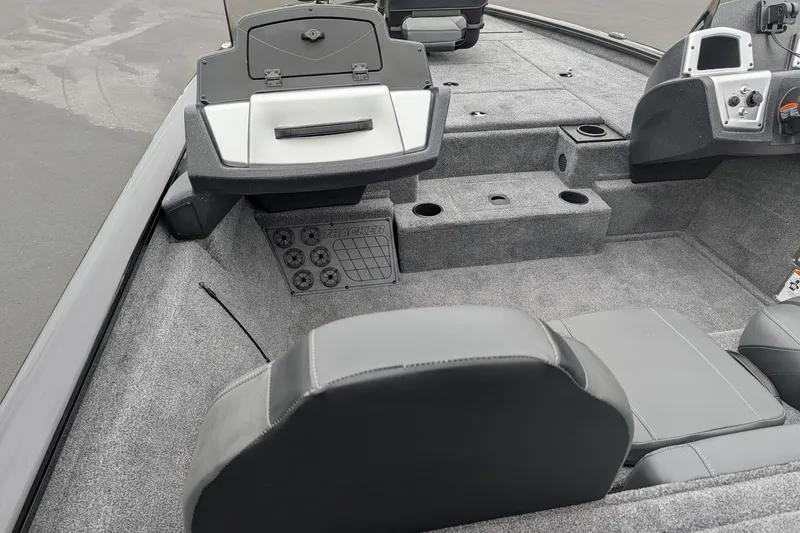 Slide: The Image of Interior of a 2026 Tracker Pro Team 195 TXW boat, featuring seating and storage compartments. - 7