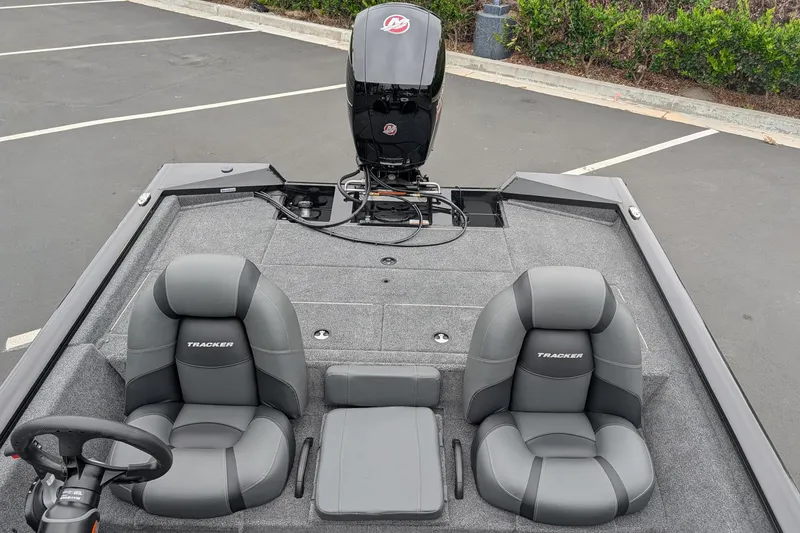 Slide: The Image of 2026 Tracker Pro Team 195 TXW boat interior with dual seats and steering wheel. - 8