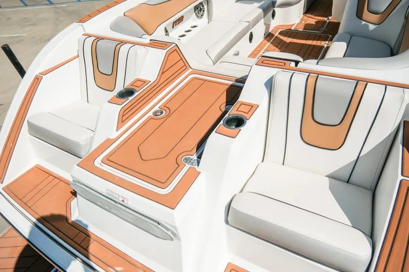 Slide: The Image of Luxurious interior of 2021 MB F24 Tomcat boat with tan and white seating. - 10