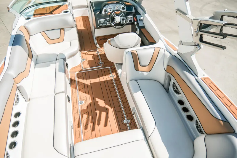 Slide: The Image of 2021 MB F24 Tomcat boat interior with luxurious seating and modern dashboard. - 12