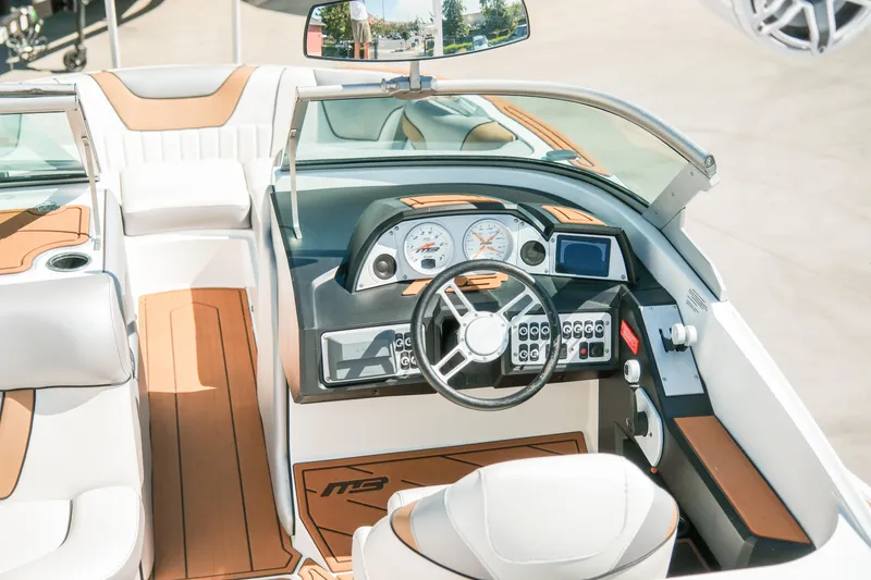 Slide: The Image of 2021 MB F24 Tomcat boat interior with modern dashboard and steering wheel. - 13