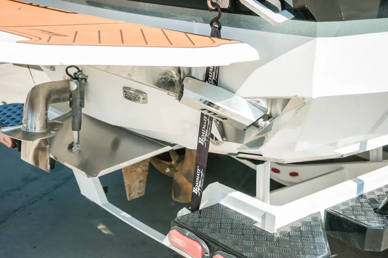Slide: The Image of 2021 MB F24 Tomcat boat rear view with propeller and exhaust details. - 18