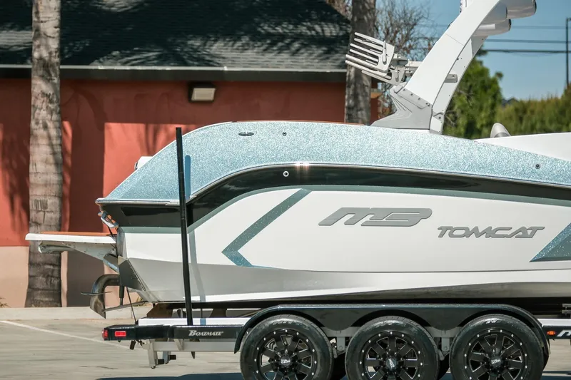 Slide: The Image of 2021 MB F24 Tomcat boat on trailer, parked outdoors. - 3