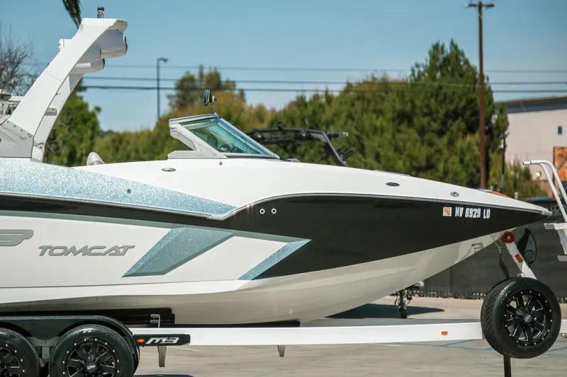 Slide: The Image of 2021 MB F24 Tomcat boat on trailer, parked outdoors. - 4