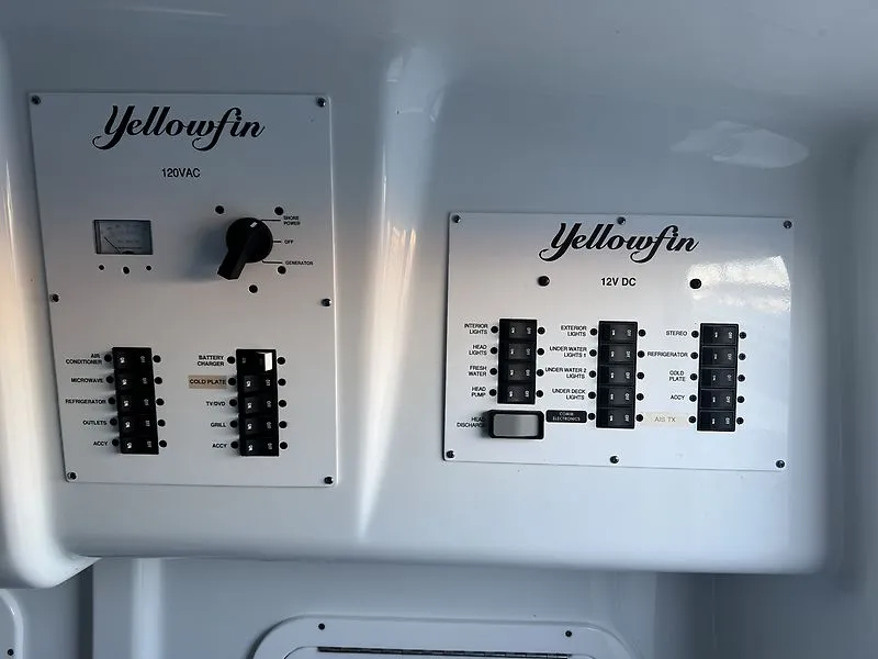 Slide: The Image of Control panels of Yellowfin 42 Offshore 2022, 120VAC and 12VDC. - 12