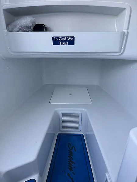 Slide: The Image of Interior of 2022 Yellowfin 42 Offshore with 'In God We Trust' sign. - 13