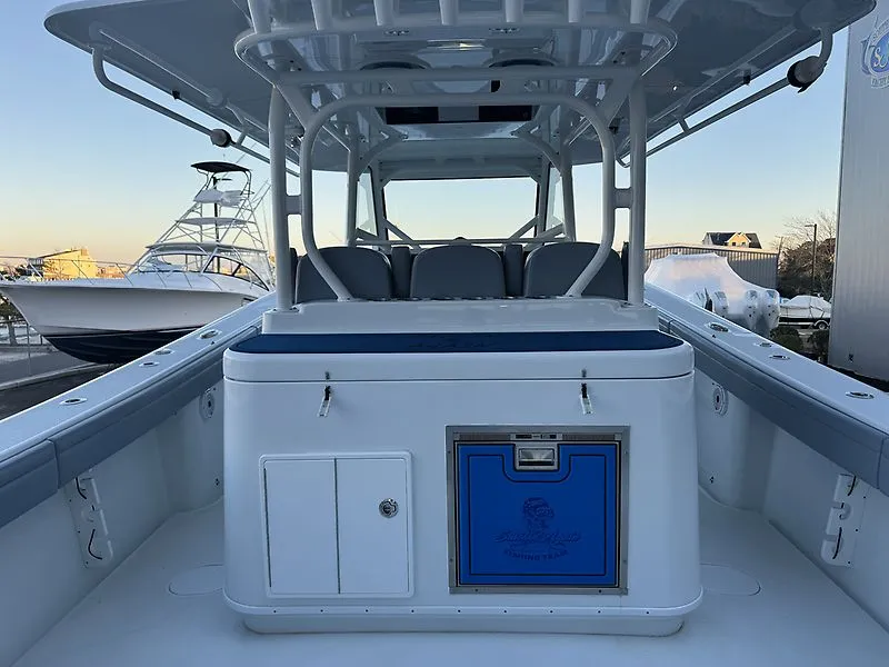 Slide: The Image of 2022 Yellowfin 42 Offshore boat with spacious deck and seating area. - 17