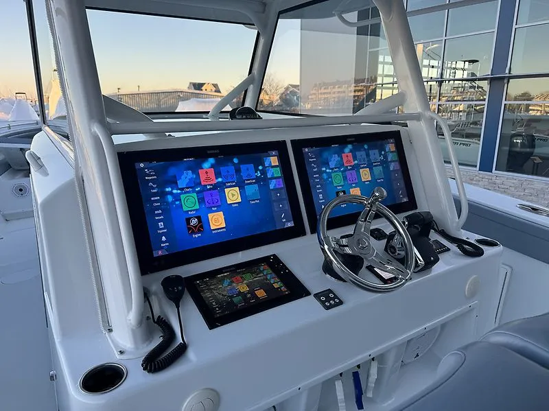 Slide: The Image of 2022 Yellowfin 42 Offshore cockpit with advanced electronics. - 7