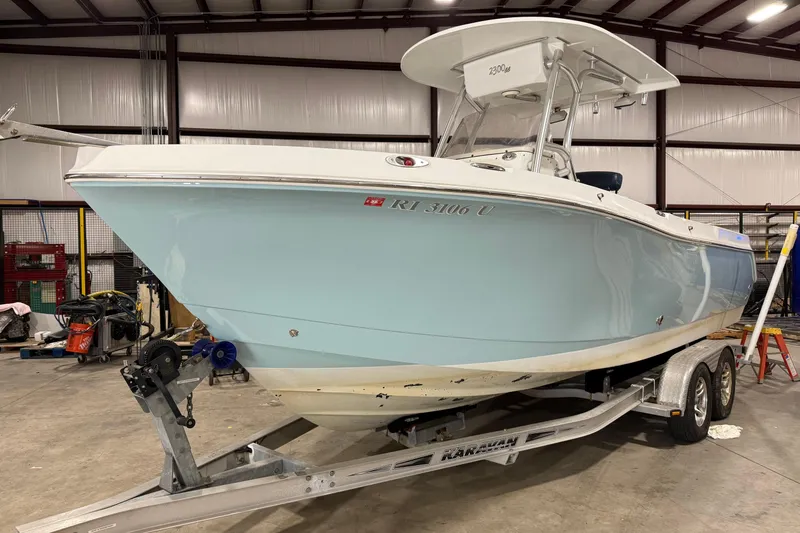 The Image of 2007 Polar 2300 Center Console boat on trailer in indoor storage facility. - 0