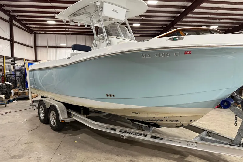 Slide: The Image of 2007 Polar 2300 Center Console boat on trailer in indoor storage facility. - 1