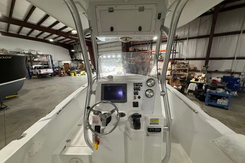 Slide: The Image of 2007 Polar 2300 Center Console boat interior in a spacious workshop. - 10