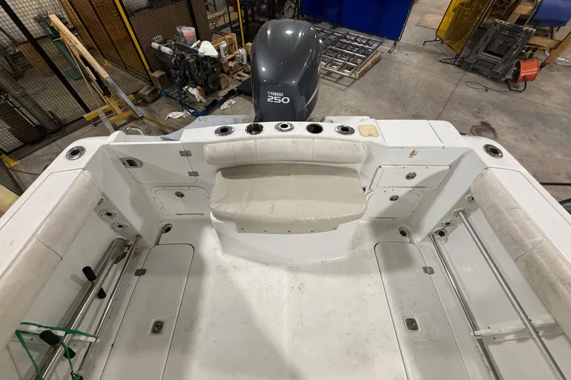 Slide: The Image of 2007 Polar 2300 Center Console boat interior with Yamaha 250 engine in a workshop. - 11