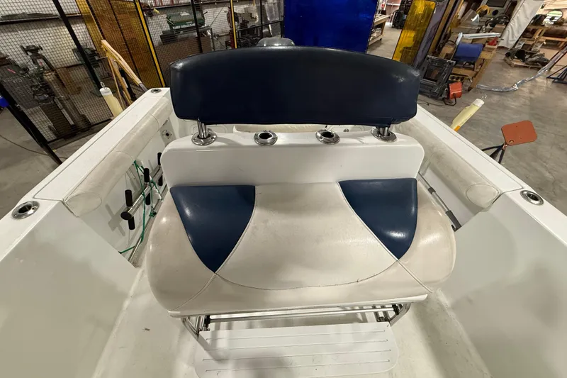 Slide: The Image of 2007 Polar 2300 Center Console boat interior with blue and white seating. - 12