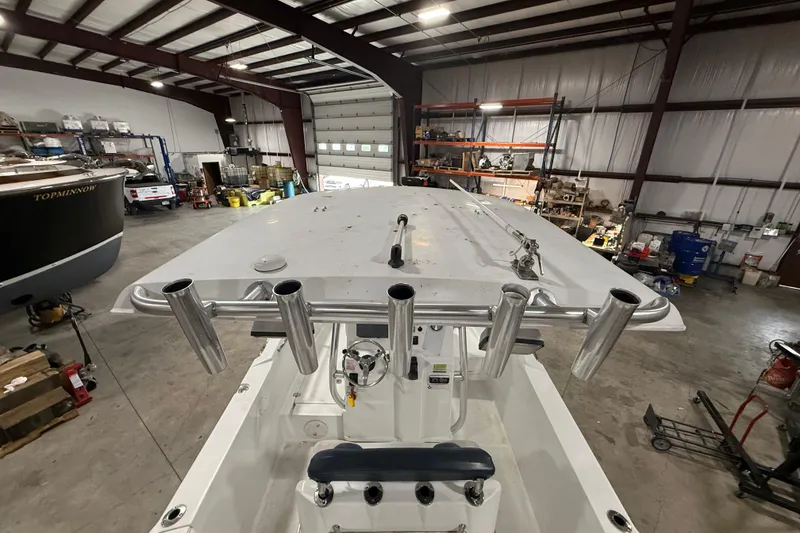 Slide: The Image of 2007 Polar 2300 Center Console boat in a spacious indoor storage facility. - 13
