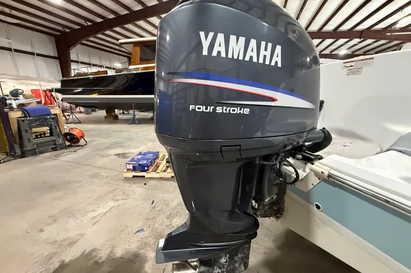 Slide: The Image of Yamaha four-stroke outboard motor on a 2007 Polar 2300 Center Console boat in a warehouse. - 17