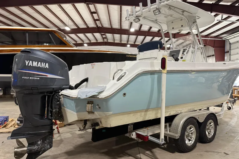 Slide: The Image of 2007 Polar 2300 Center Console boat with Yamaha four-stroke engine in a storage facility. - 4