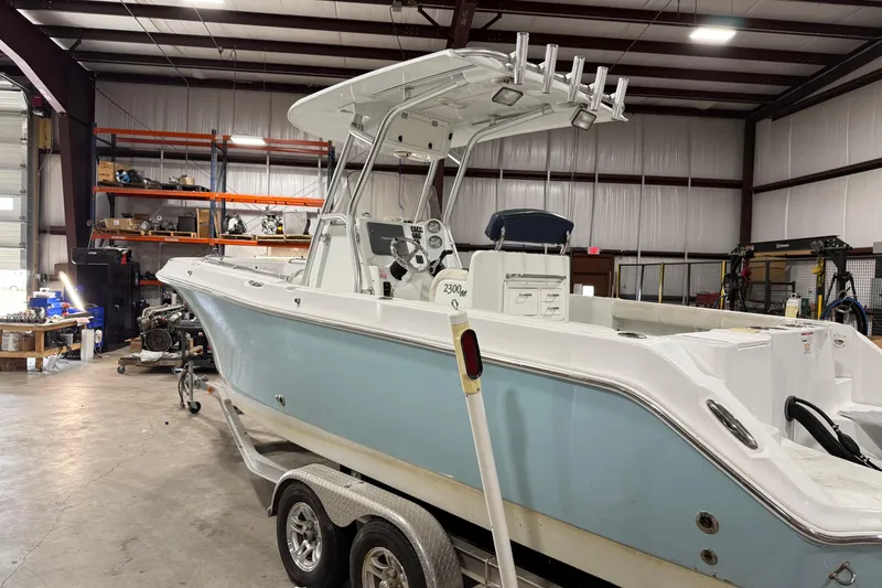 Slide: The Image of 2007 Polar 2300 Center Console boat in a workshop on a trailer. - 5