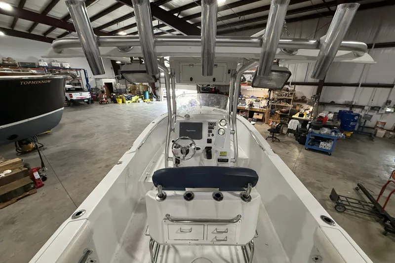 Slide: The Image of 2007 Polar 2300 Center Console boat in a spacious indoor storage facility. - 9