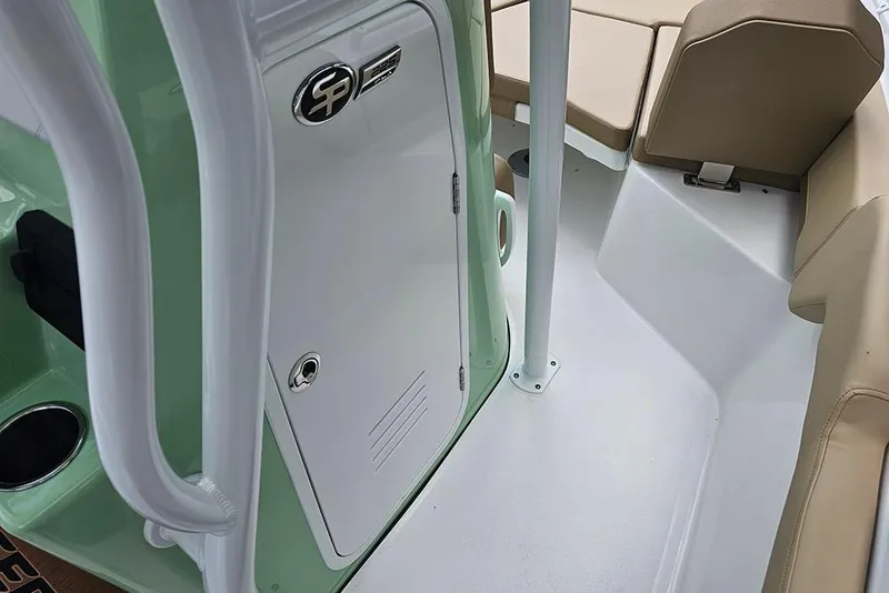 Slide: The Image of Interior view of 2026 Sea Pro 225FLX Sandbar boat, featuring seating and storage. - 19