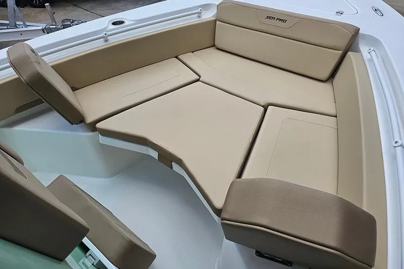 Slide: The Image of 2026 Sea Pro 225FLX Sandbar boat with beige cushioned seating area. - 21