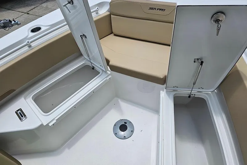Slide: The Image of 2026 Sea Pro 225FLX Sandbar boat interior with open storage compartments and seating. - 25