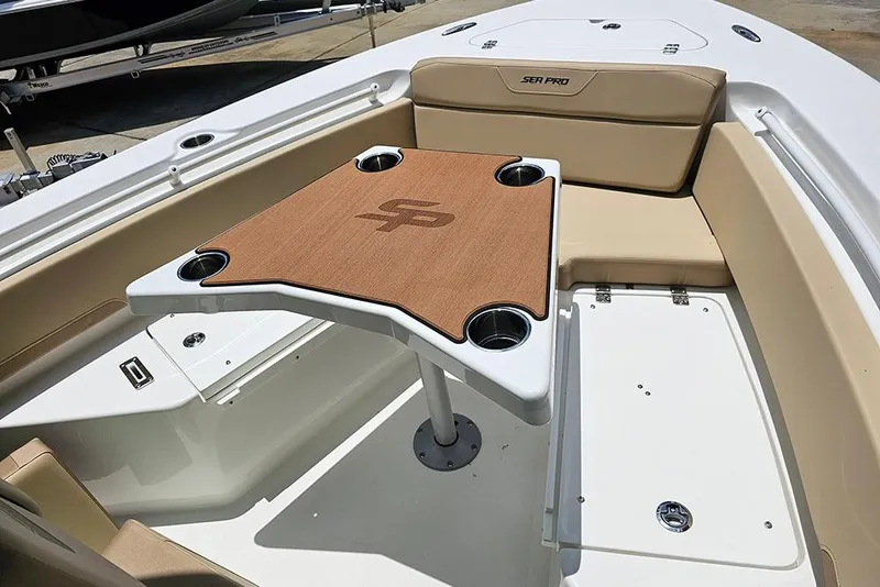 Slide: The Image of 2026 Sea Pro 225FLX Sandbar boat interior with seating and table. - 26