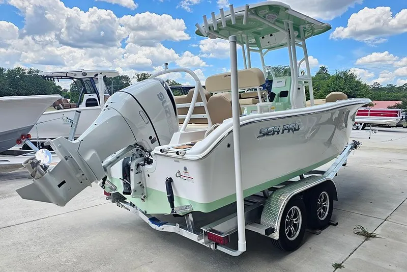Slide: The Image of 2026 Sea Pro 225FLX Sandbar boat on trailer, featuring Suzuki outboard motor. - 3