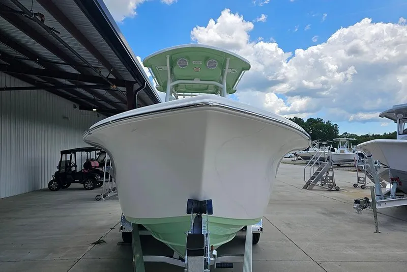 Slide: The Image of 2026 Sea Pro 225FLX Sandbar boat on trailer, under blue sky with clouds. - 4