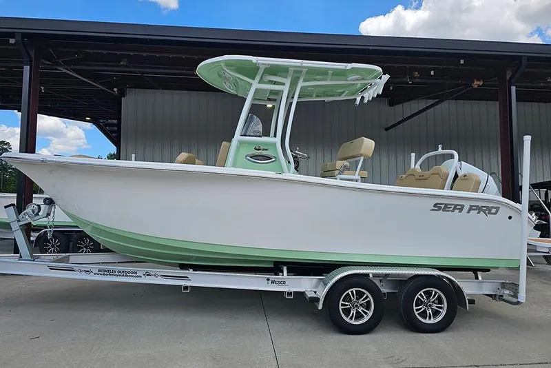 Slide: The Image of 2026 Sea Pro 225FLX Sandbar boat on trailer, displayed outdoors. - 7