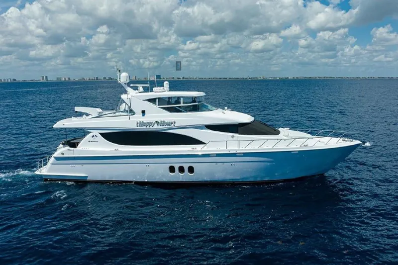 The Image of 2007 Hatteras 80 Motor Yacht cruising on open sea under cloudy sky. - 0