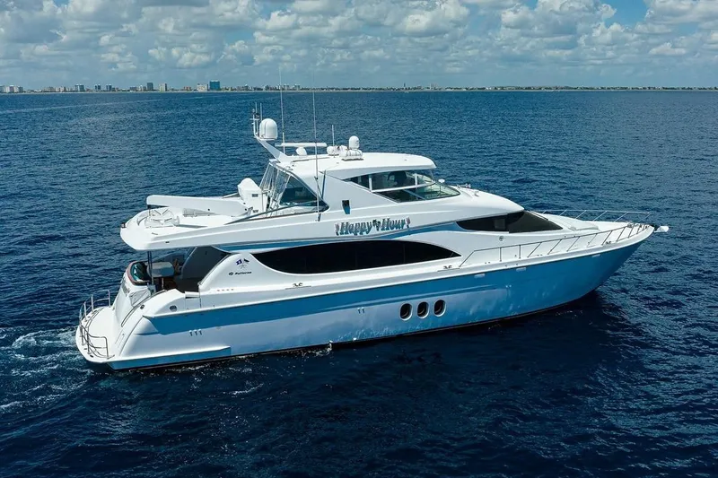 Slide: The Image of 2007 Hatteras 80 Motor Yacht cruising on open sea under a partly cloudy sky. - 1