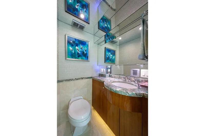 Slide: The Image of Luxurious bathroom in 2007 Hatteras 80 Motor Yacht with elegant marble countertop and modern fixtures. - 17