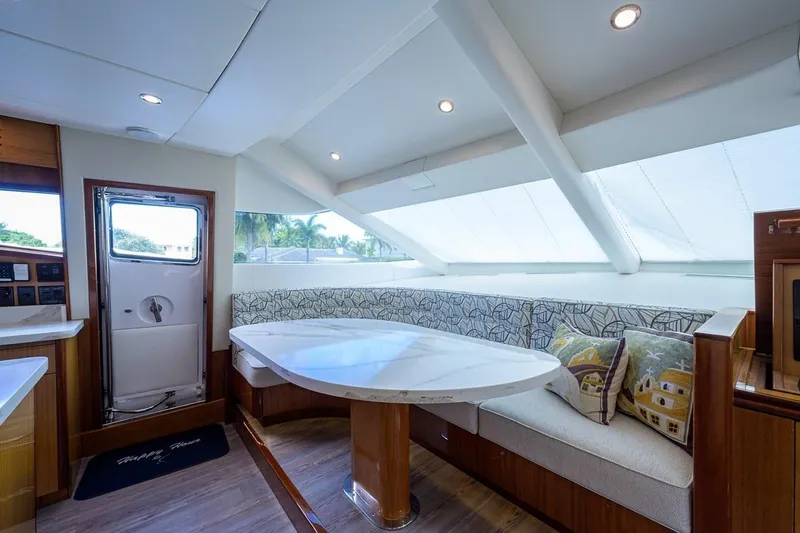 Slide: The Image of Luxurious interior of 2007 Hatteras 80 Motor Yacht with elegant seating and modern design. - 18