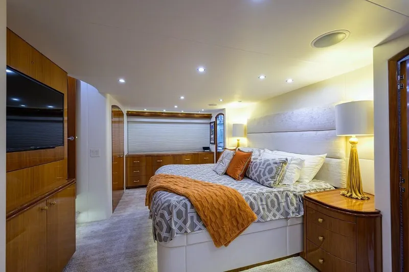 Slide: The Image of Luxurious bedroom interior of 2007 Hatteras 80 Motor Yacht with elegant decor and ambient lighting. - 22