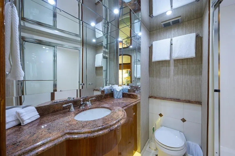 Slide: The Image of Luxurious bathroom in a 2007 Hatteras 80 Motor Yacht with elegant fixtures and granite countertop. - 25