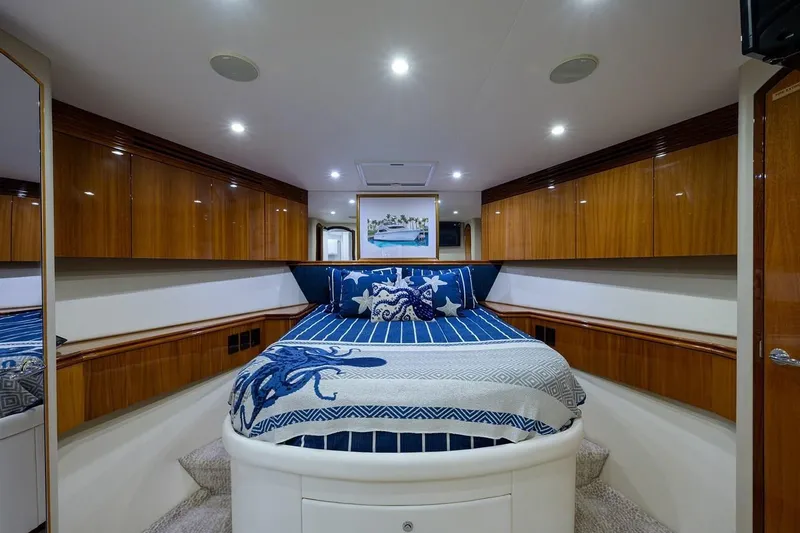 Slide: The Image of Luxurious bedroom interior of 2007 Hatteras 80 Motor Yacht with elegant wood cabinetry. - 26