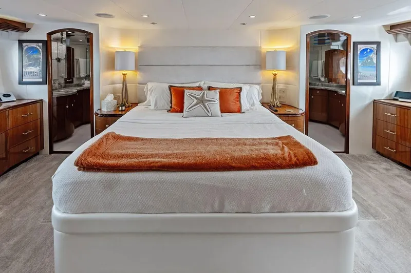 Slide: The Image of Luxurious bedroom interior of 2007 Hatteras 80 Motor Yacht with elegant decor and warm lighting. - 21