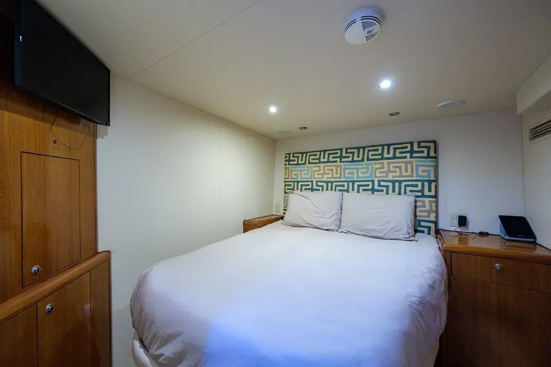 Slide: The Image of Luxurious bedroom interior of 2007 Hatteras 80 Motor Yacht with modern decor and amenities. - 30