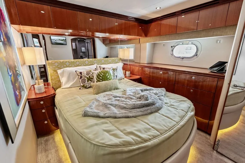 Slide: The Image of Luxurious bedroom interior of 2007 Hatteras 80 Motor Yacht with elegant wood finishes. - 28