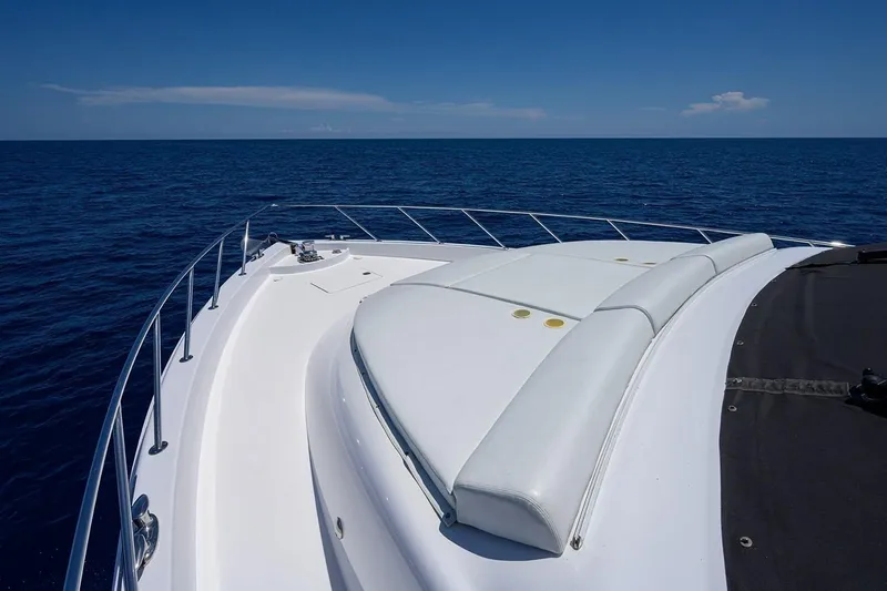 Slide: The Image of 2007 Hatteras 80 Motor Yacht bow view on open sea under clear blue sky. - 6