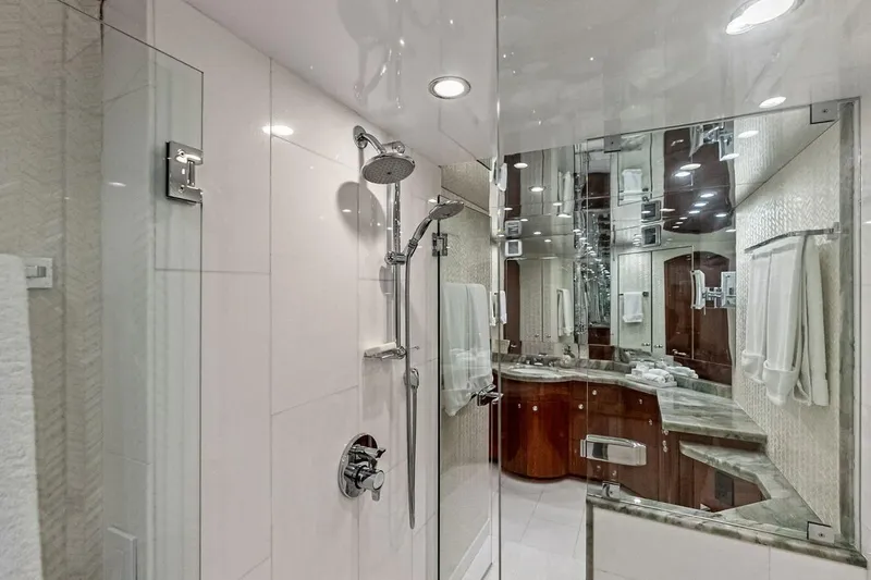 Slide: The Image of Luxurious bathroom in 2007 Hatteras 80 Motor Yacht with glass shower and elegant fixtures. - 27